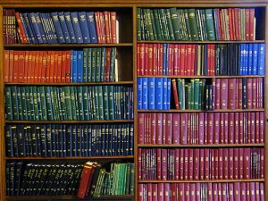 A library shelf full of reference books.